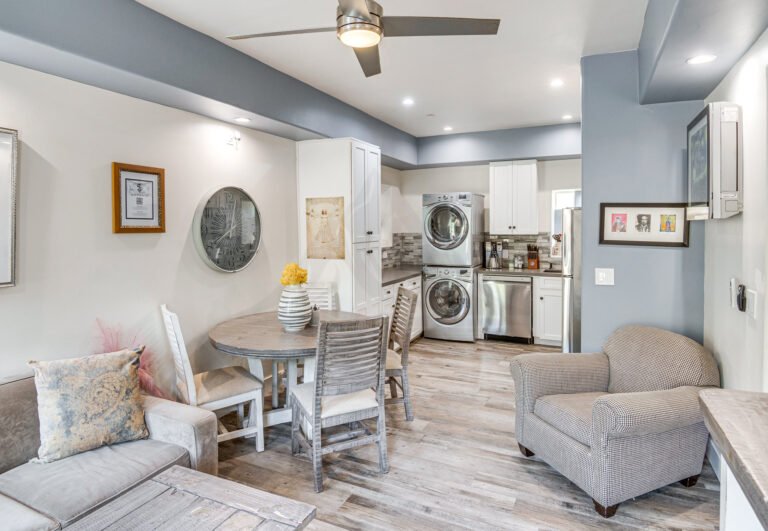 Modern kitchen with stainless steel appliances and white cabinetry in Newbury Park executive rental