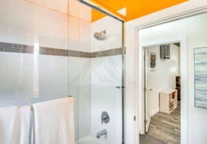 Modern bathroom with walk-in shower and contemporary vanity at The Creek Retreats